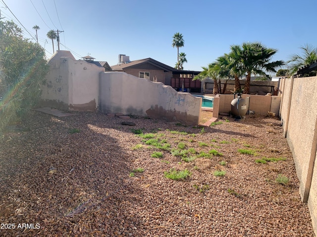 view of yard with a fenced in pool and a fenced backyard