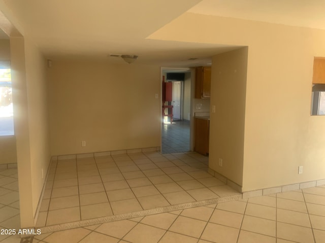 spare room featuring light tile patterned floors