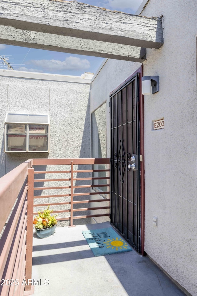 3330 W Danbury Dr Unit E203, Phoenix, AZ 85053 - doorway to property with stucco siding