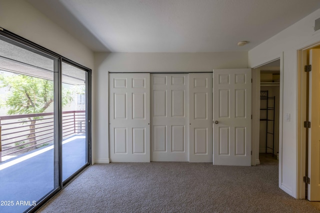 3330 W Danbury Dr Unit E203, Phoenix, AZ 85053 - unfurnished bedroom with carpet, a closet, and access to exterior