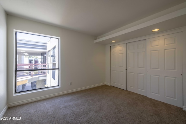 3330 W Danbury Dr Unit E203, Phoenix, AZ 85053 - unfurnished bedroom with carpet, recessed lighting, and a closet