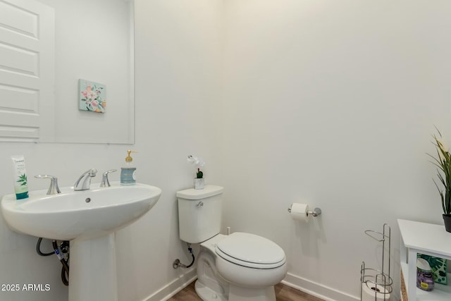 bathroom featuring toilet and sink