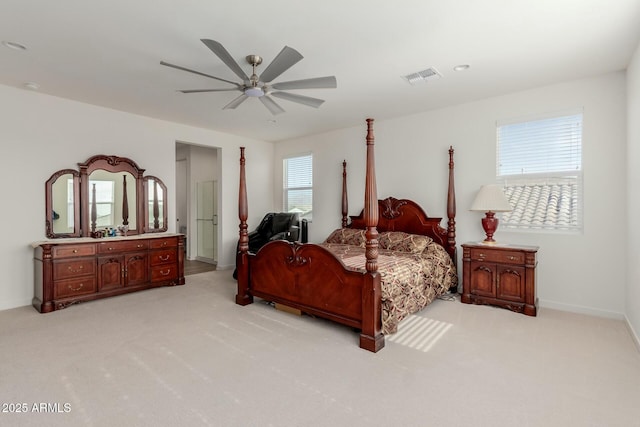 bedroom with ceiling fan and light colored carpet