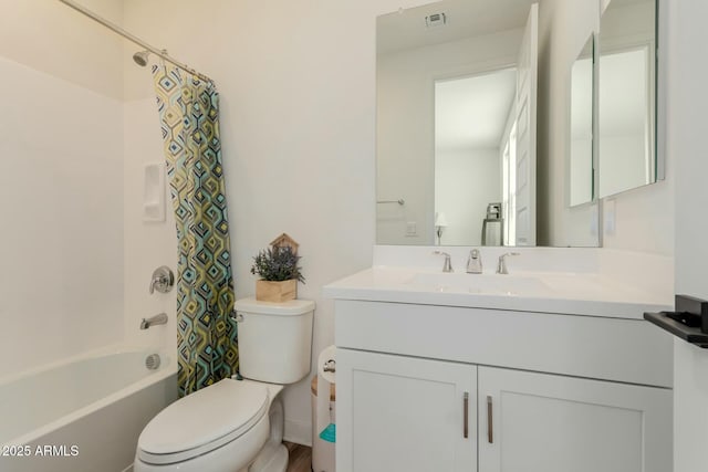 full bathroom featuring toilet, vanity, and shower / tub combo with curtain