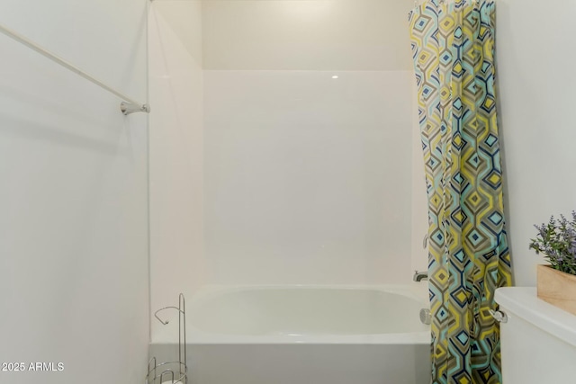 bathroom with toilet and shower / tub combo with curtain