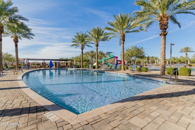 view of swimming pool featuring a patio area