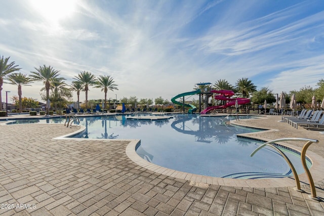 view of swimming pool featuring a water slide