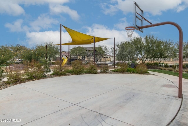 view of sport court with a playground