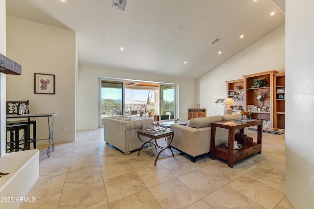 living area with recessed lighting, visible vents, and high vaulted ceiling