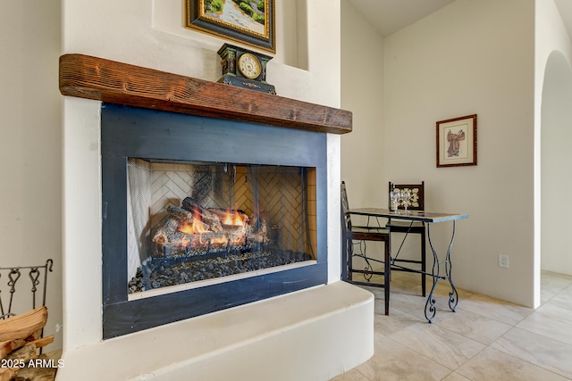 details with a warm lit fireplace