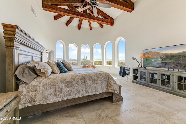 bedroom with ceiling fan, beamed ceiling, visible vents, and high vaulted ceiling