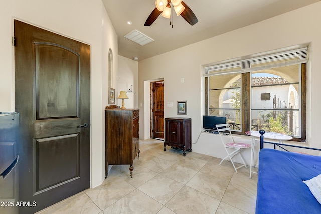 bedroom featuring light tile patterned floors, a ceiling fan, and visible vents