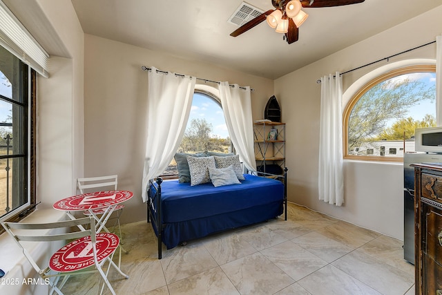 bedroom with visible vents and ceiling fan