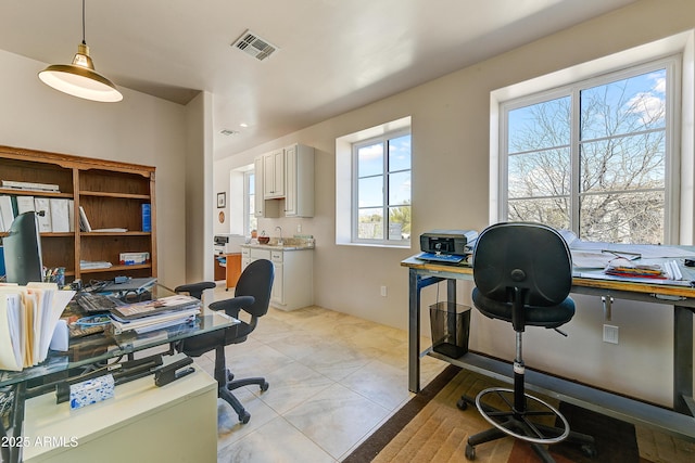 home office with visible vents and light tile patterned flooring