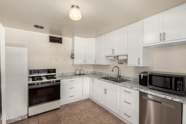 3617 W Luke Ave, Phoenix, AZ 85019 - kitchen featuring stainless steel appliances, white cabinetry, and a sink