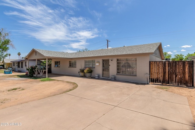 3617 W Luke Ave, Phoenix, AZ 85019 - ranch-style home with a shingled roof and fence