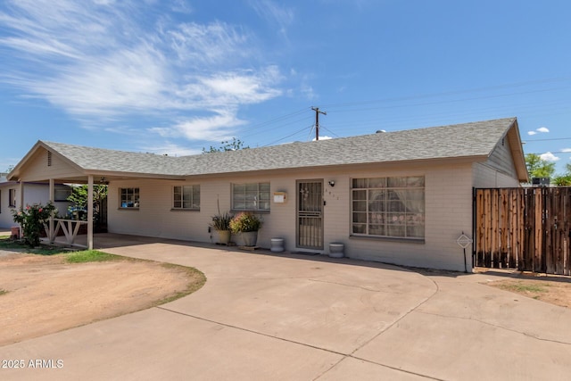 3617 W Luke Ave, Phoenix, AZ 85019 - ranch-style house featuring brick siding, roof with shingles, and fence