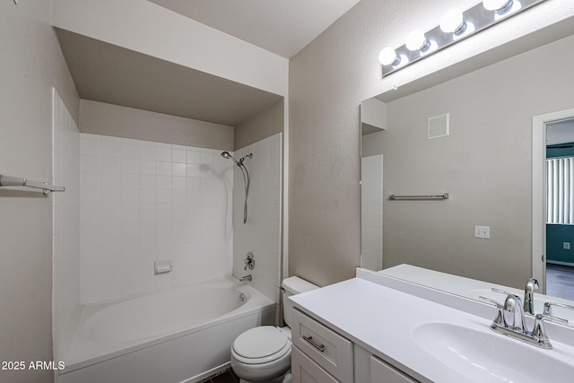 5401 E Van Buren St Unit 2095, Phoenix, AZ 85008 - bathroom featuring visible vents, a textured wall, toilet, vanity, and shower / tub combination