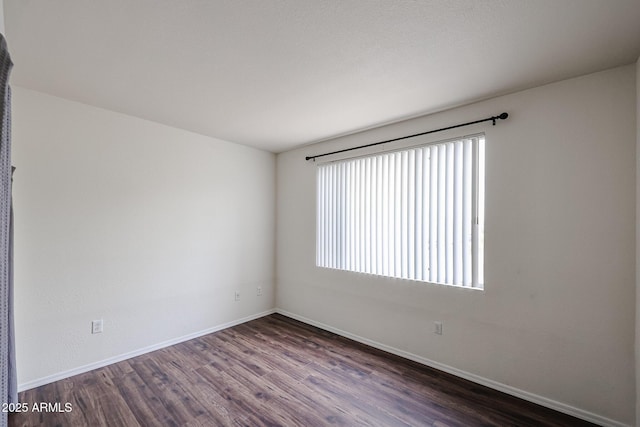 5401 E Van Buren St Unit 2095, Phoenix, AZ 85008 - spare room with dark wood finished floors and baseboards