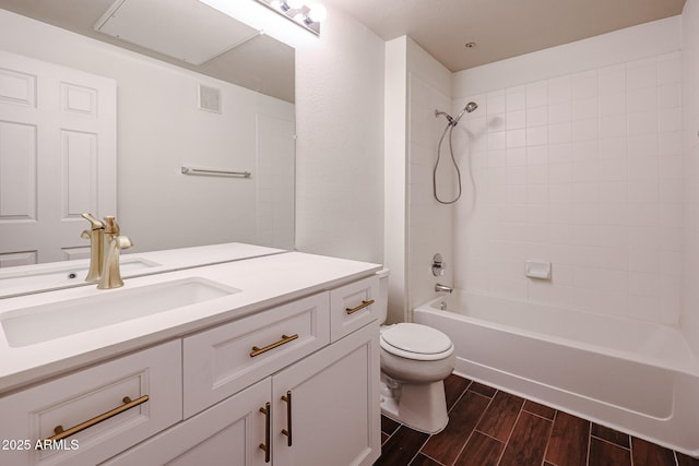 5401 E Van Buren St Unit 2095, Phoenix, AZ 85008 - bathroom featuring wood finish floors, visible vents, toilet, vanity, and  shower combination