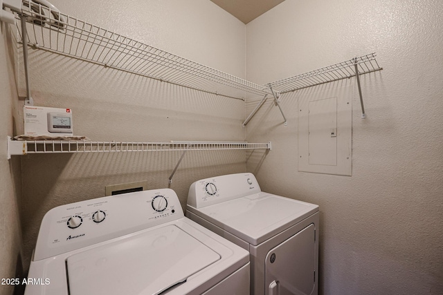 5401 E Van Buren St Unit 2095, Phoenix, AZ 85008 - clothes washing area featuring laundry area, a textured wall, and washing machine and clothes dryer