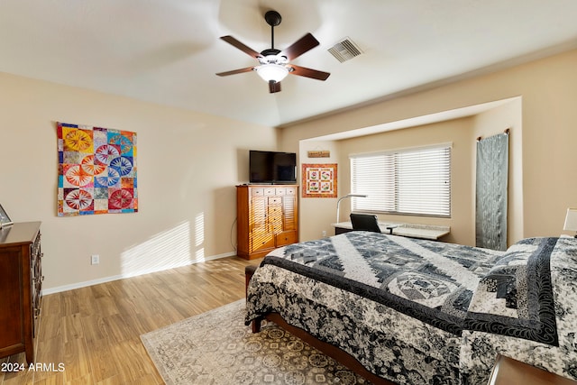 bedroom featuring light wood-type flooring and ceiling fan