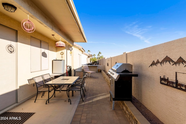 view of patio featuring a grill and exterior kitchen