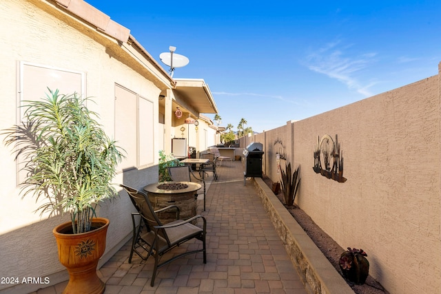 view of patio featuring a grill