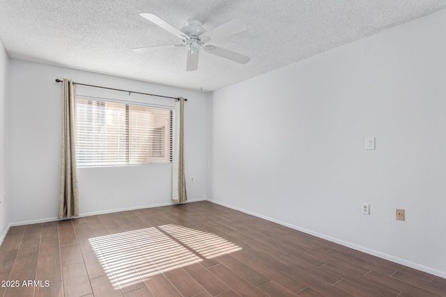 empty room featuring a textured ceiling and ceiling fan