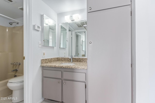 full bathroom featuring toilet, bathtub / shower combination, and vanity