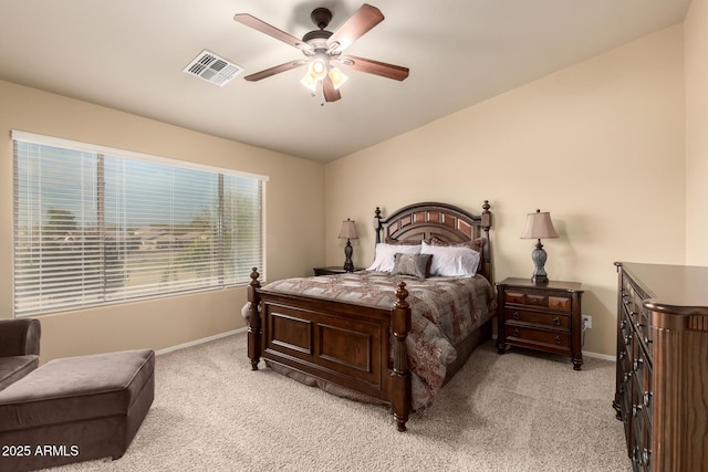 bedroom with baseboards, visible vents, a ceiling fan, light colored carpet, and lofted ceiling