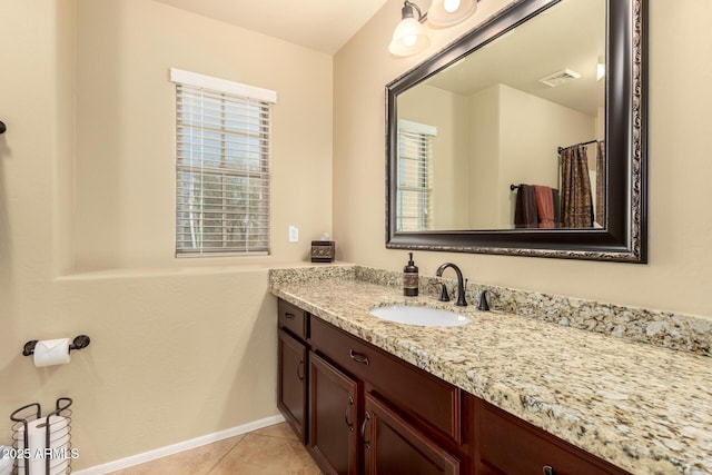 full bathroom with baseboards, vanity, visible vents, and tile patterned floors