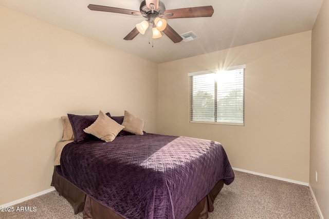 carpeted bedroom featuring visible vents, ceiling fan, and baseboards