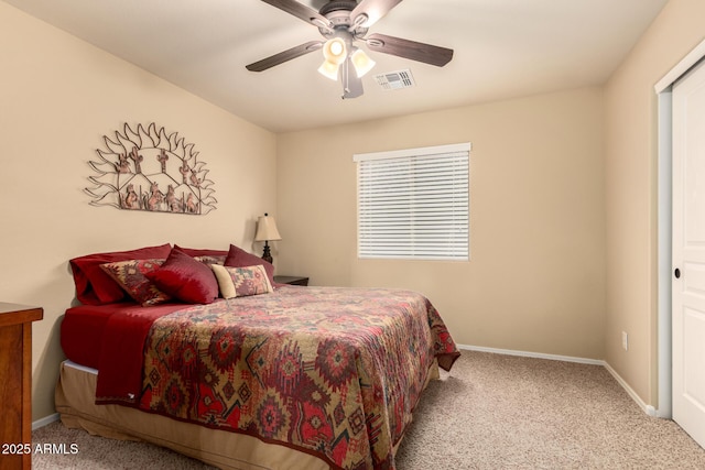 bedroom with a ceiling fan, carpet flooring, visible vents, and baseboards