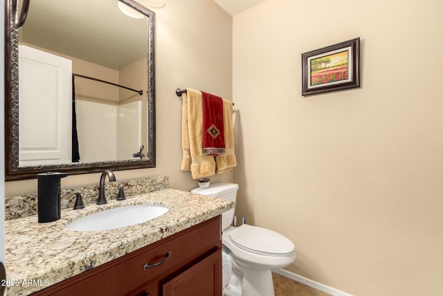 full bathroom with toilet, vanity, walk in shower, baseboards, and tile patterned floors