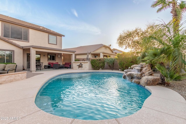 view of swimming pool with a patio area, outdoor lounge area, and a fenced in pool