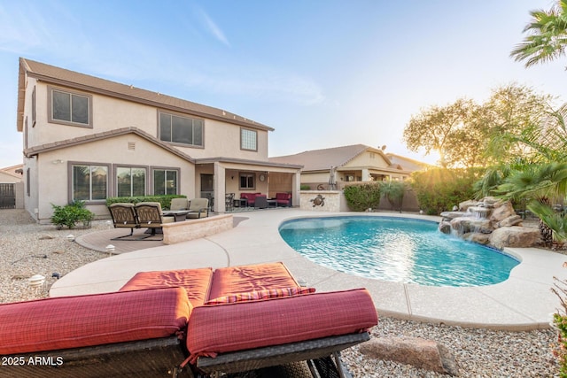 view of pool with an outdoor hangout area, a patio area, and a fenced in pool