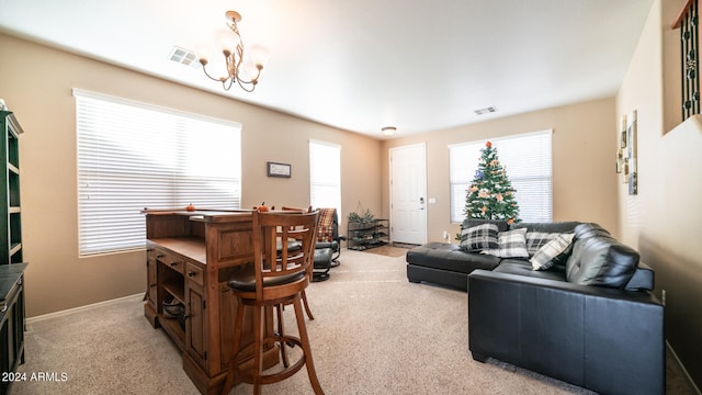 carpeted living room with a wealth of natural light and a notable chandelier