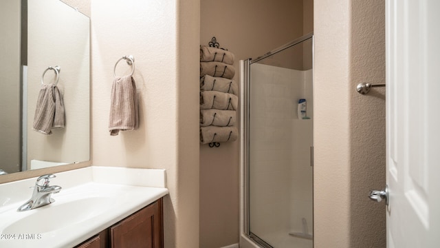 bathroom with vanity and an enclosed shower