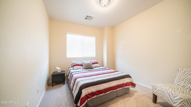 carpeted bedroom with lofted ceiling