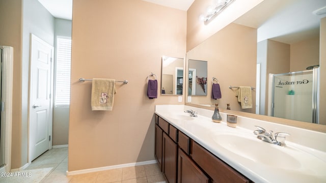 bathroom with vanity, tile patterned floors, and walk in shower