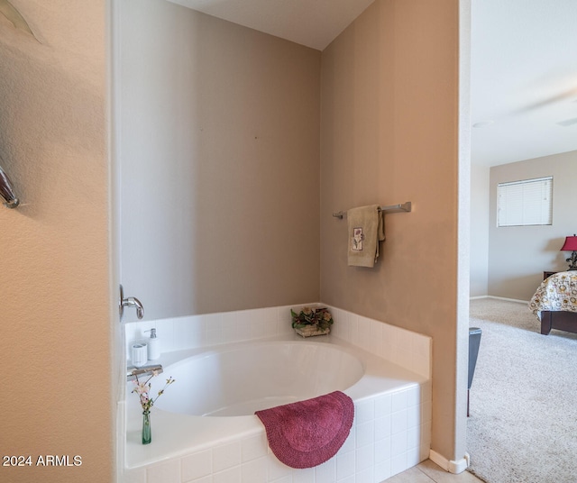 bathroom featuring tiled bath