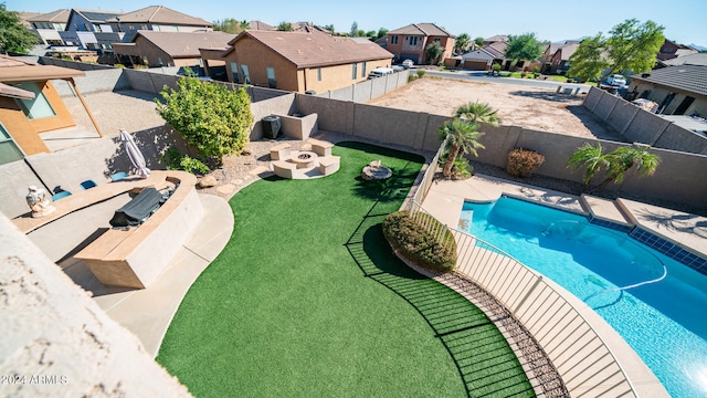 view of pool featuring a patio and a lawn