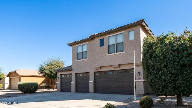 view of front of property with a garage