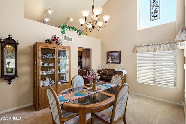 4002 N San Gabriel Cir, Mesa, AZ 85215 - dining room with light colored carpet, a chandelier, plenty of natural light, and a high ceiling