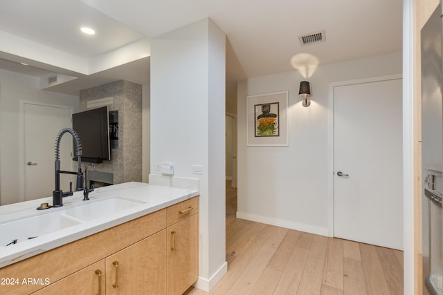 bathroom featuring vanity and hardwood / wood-style floors