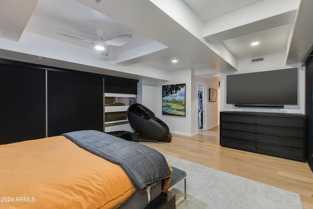 bedroom with light hardwood / wood-style flooring and ceiling fan