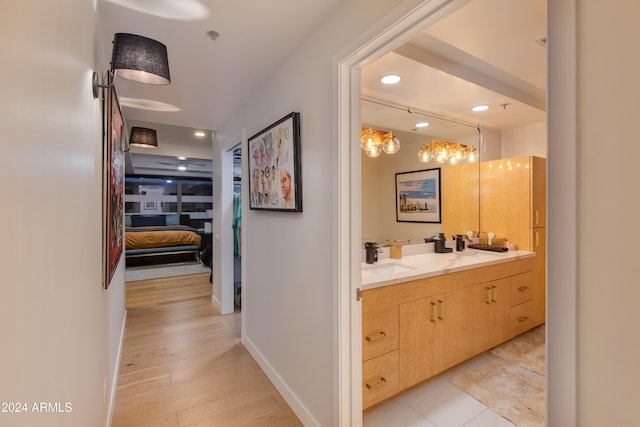 bathroom with vanity and wood-type flooring