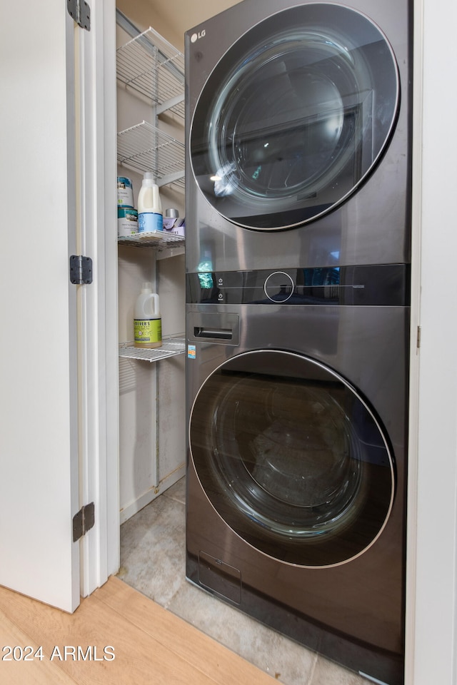 laundry room featuring stacked washing maching and dryer