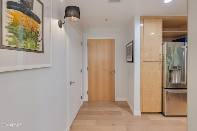 hall with light wood-type flooring